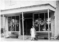 Uranna Wymer Davis in front of the store, sometime in the 1930s